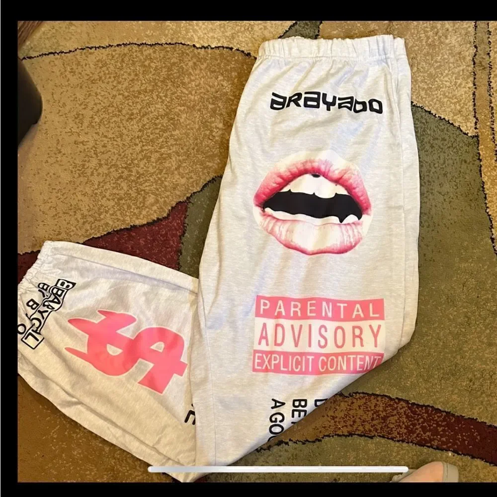 Y2K Printed joggers. Elastic at the ankle letter print with pockets. . Polyester